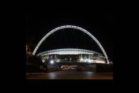 At night the stadium’s landmark arch can be seen across London